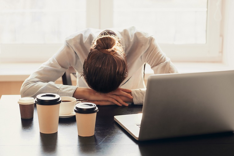 Employee struggling with fatigue at work.